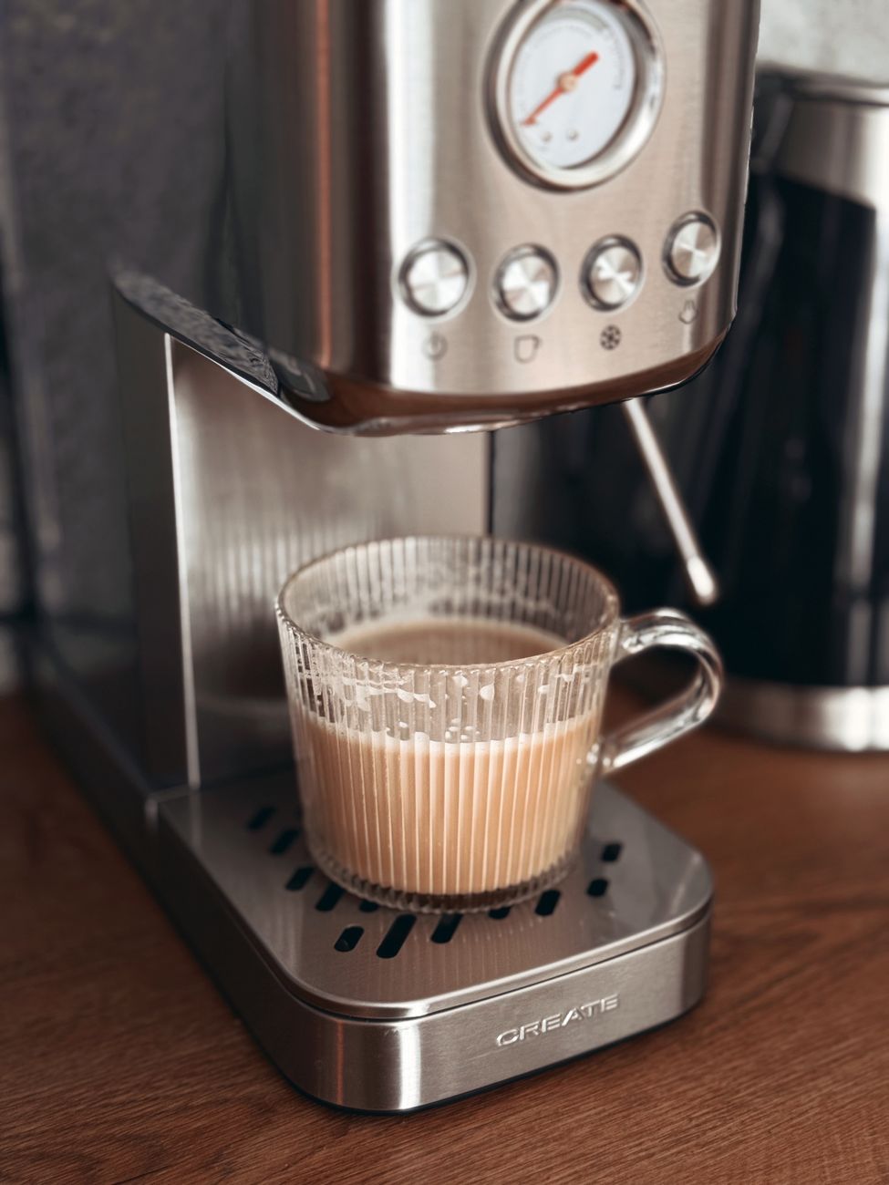 sleek coffee machine brewing cappuccino