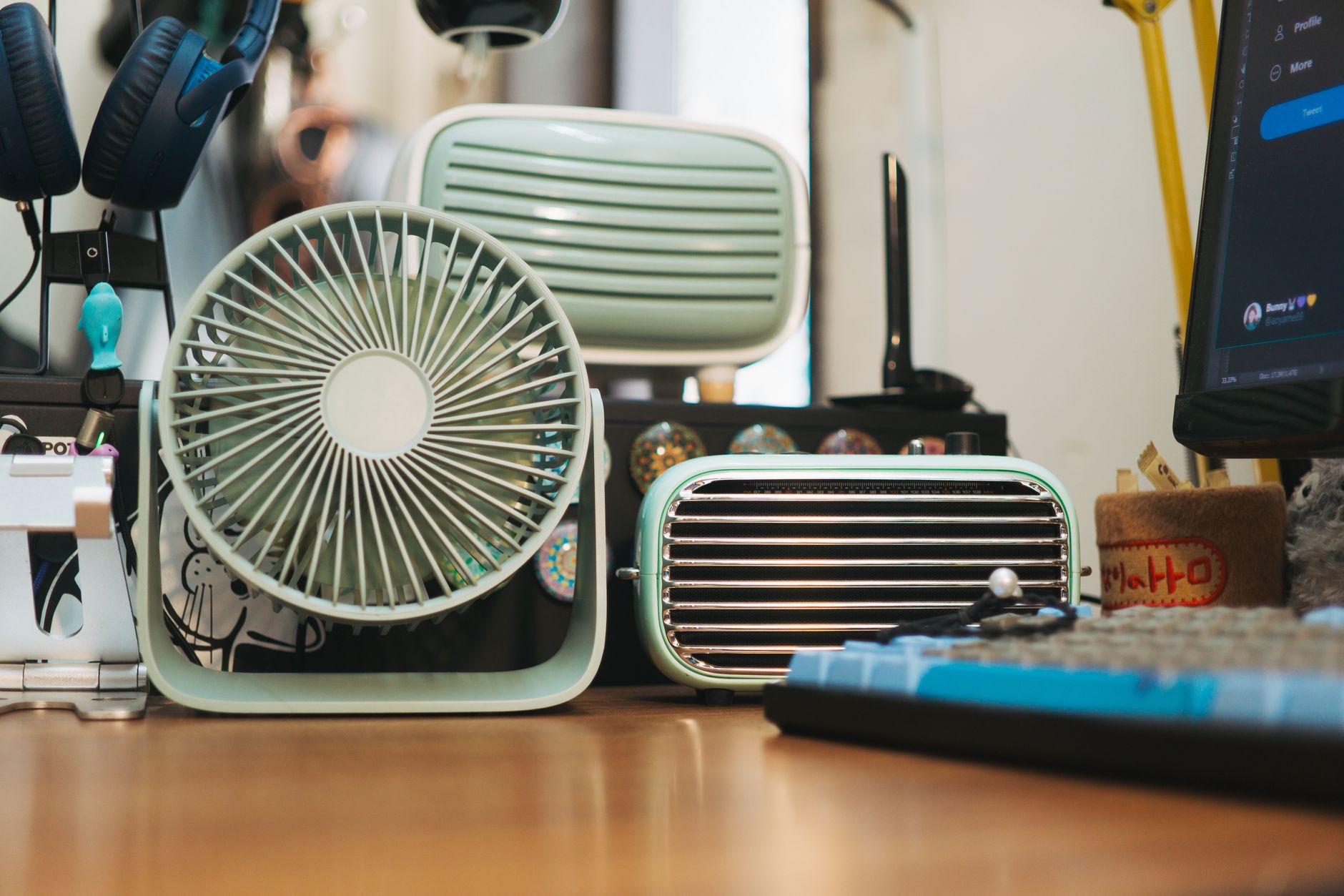 antique fan and a radio on a desk