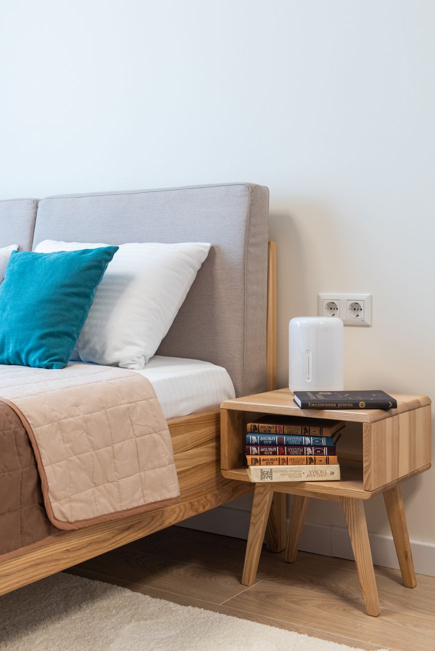 stack of books placed in a bedside table