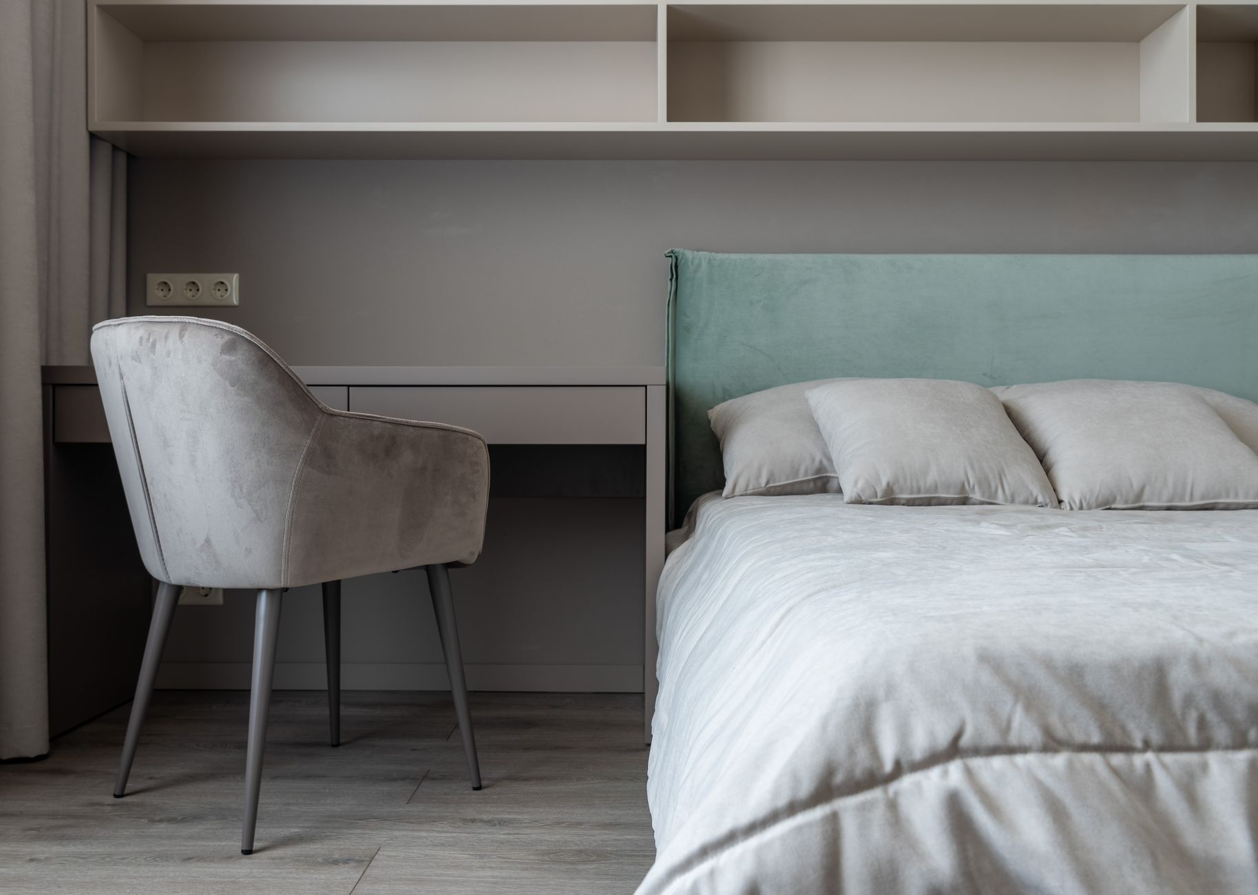 apartment interior with bed near table with chair