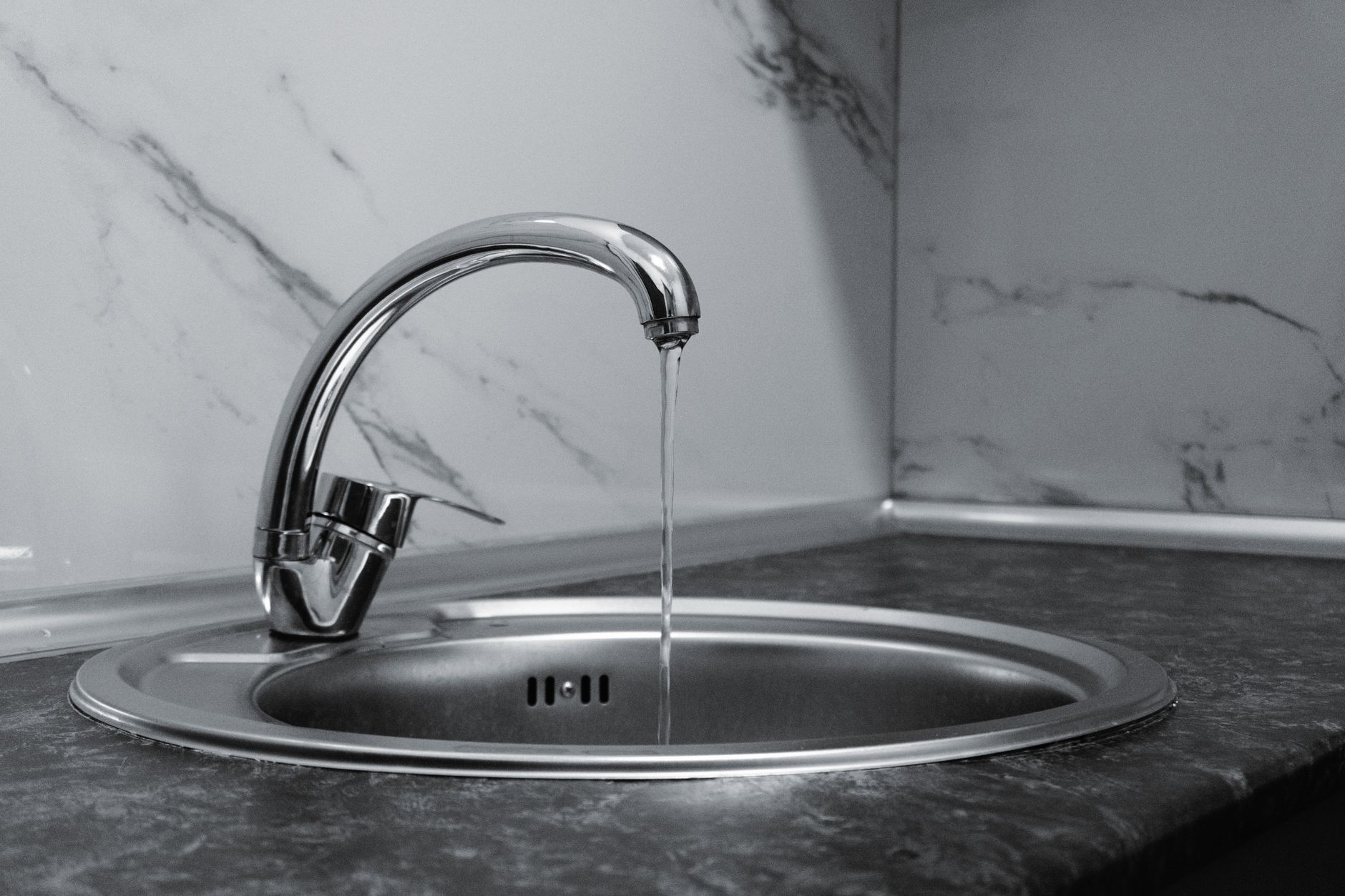 modern chrome kitchen faucet with running water